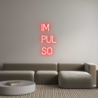 Red custom neon LED sign "IM PUL SO" on unique plexiglass backing, illuminating a modern living room with grey sofa and round table. Scritte neon personalizzate.